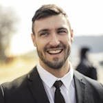 Man in Black Suit Smiling